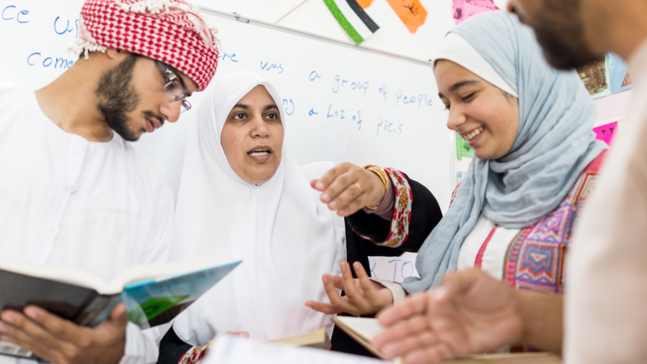 Arabic young people having school activities together